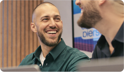 Members of the Eventornado team laughing during a hackathon